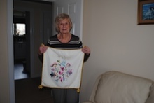 Evelyn with a cushion that she made