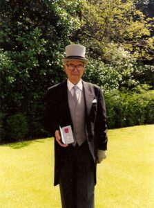 Henry receiving his MBE 1999
