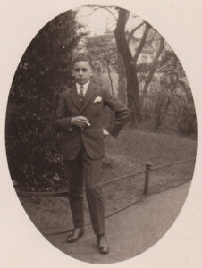 Martin Anson as a young man smartly dressed in suit c1930 smoking a cigarette
