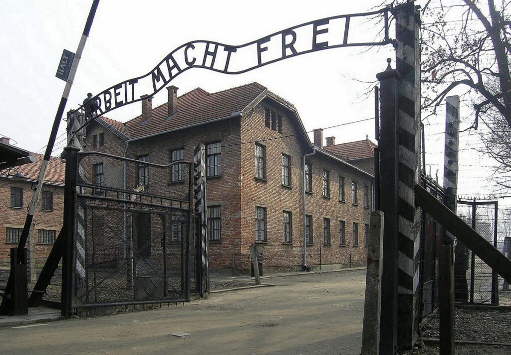 The notorious barracks gate at Auschwitz II-Birkenau with the cynical Nazi statement ‘Arbeit macht frei’, or ‘Work shall set you free’, in a photograph from 2007. (photograph by Dnalor 01, Creative Commons Attribution-Share Alike 3.0 Austria, courtesy of Wikipedia)